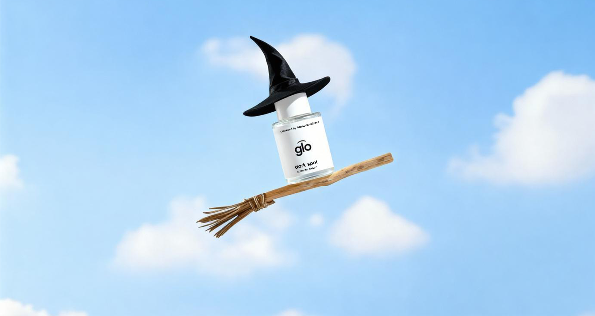 Glo Skin Beauty product with a witch hat and broom against a blue sky background